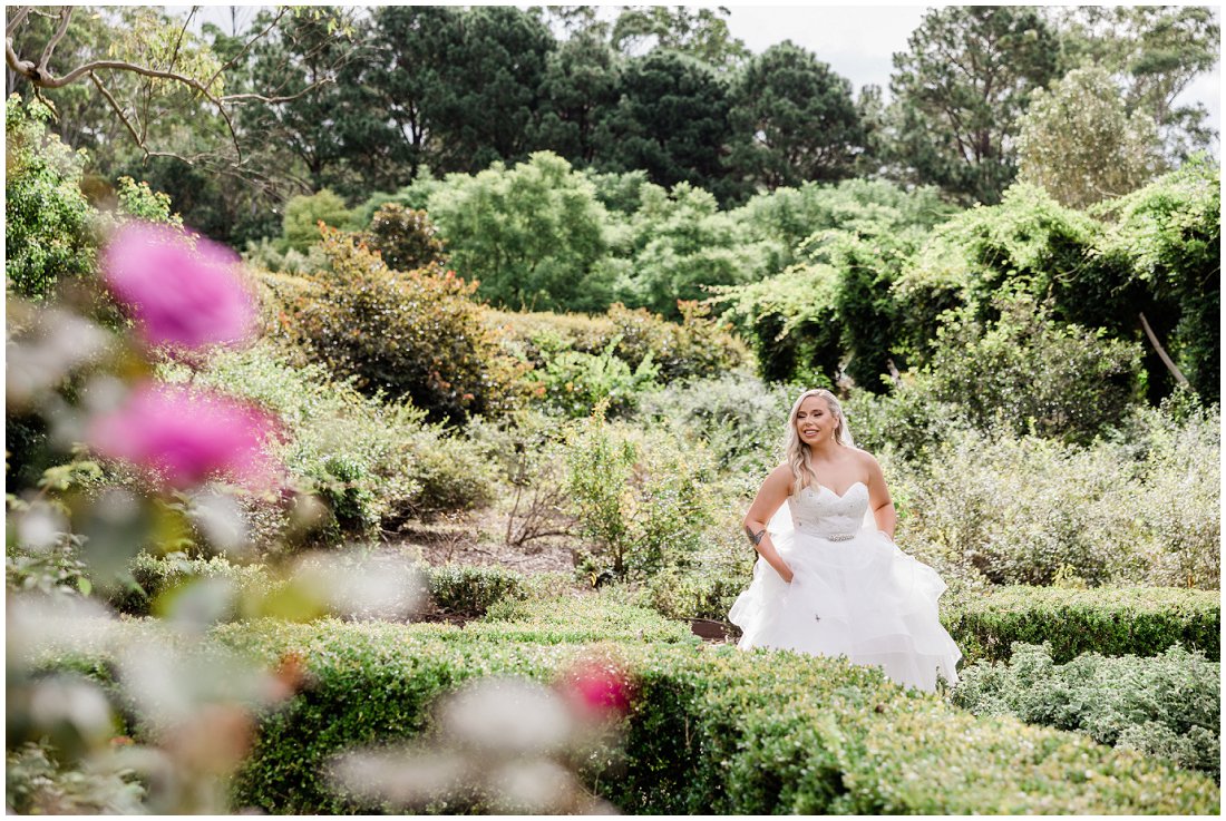 bride walking through garden