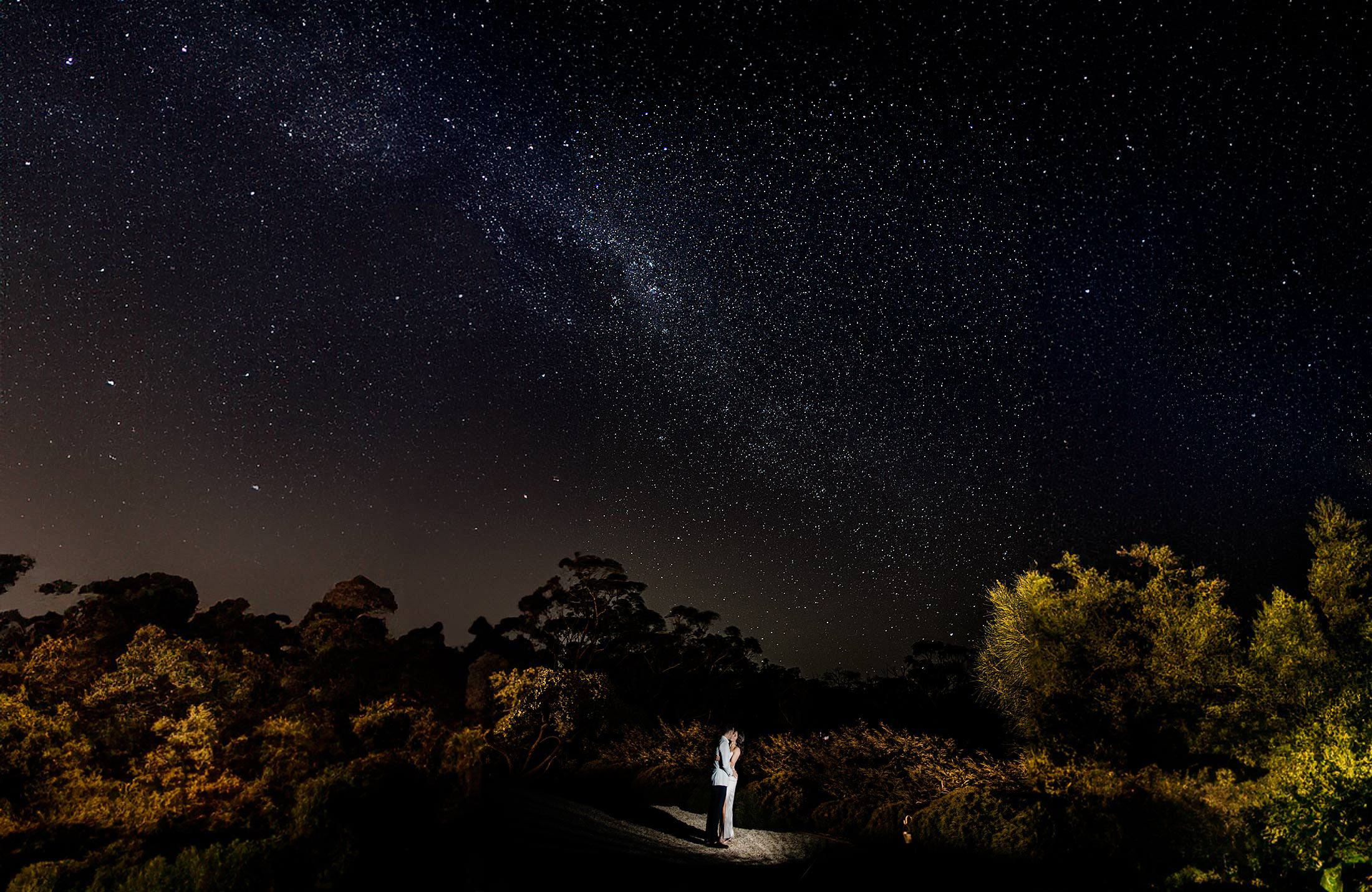 bride and groom with milky way